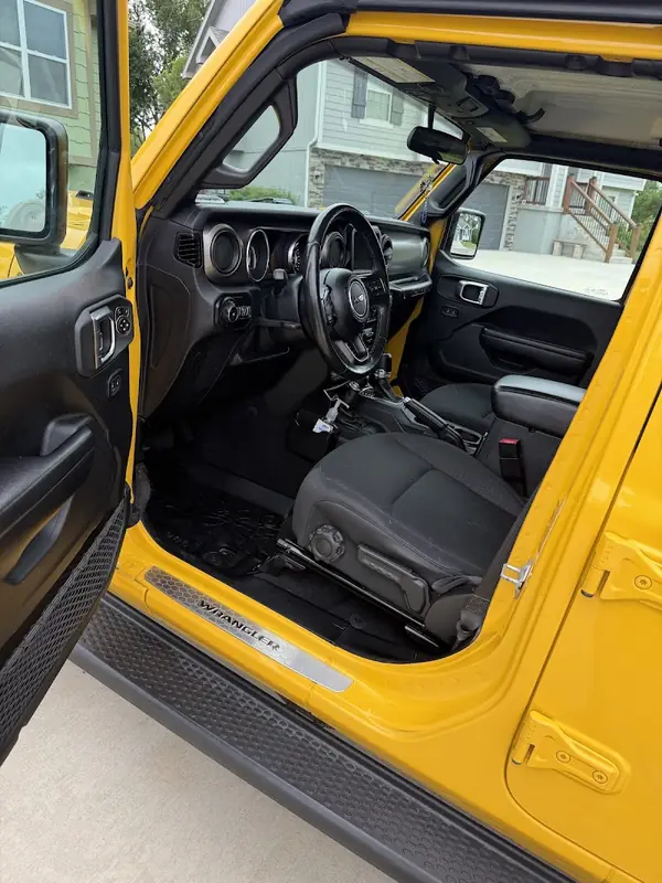 Customer's yellow Jeep interior after an Aqulux detail